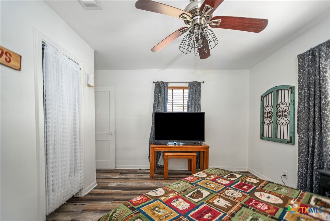 101 Lubbock Street Point Comfort, TX 77979 - Photo 29 of 34 a living room with furniture and a flat screen tv