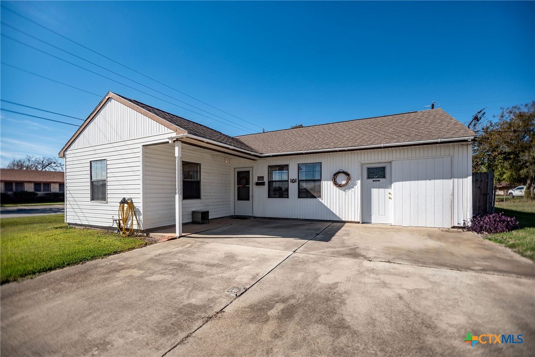 101 Lubbock Street Point Comfort, TX 77979 - Photo 3 of 34 a front view of a house with garden