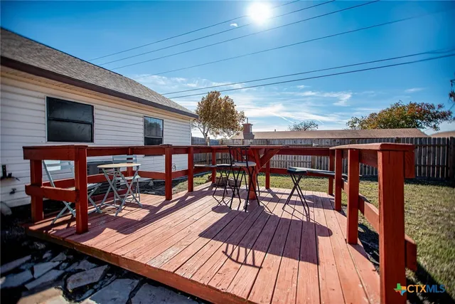 a view of a patio with wooden floor