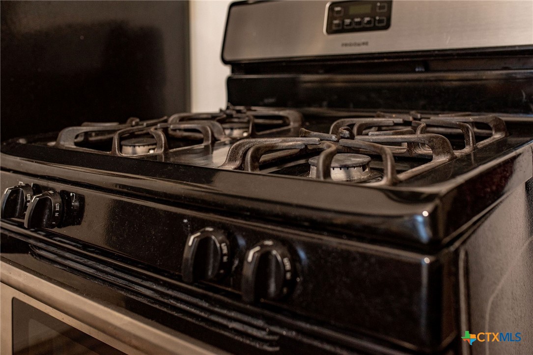 101 Lubbock Street Point Comfort, TX 77979 - Photo 9 of 34 a close up of a stove top oven