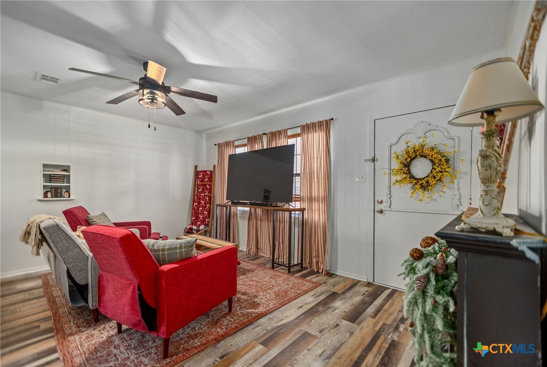 101 Lubbock Street Point Comfort, TX 77979 - Photo 10 of 34 a living room with furniture and a flat screen tv