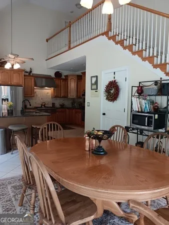 a view of a chairs and table in the patio