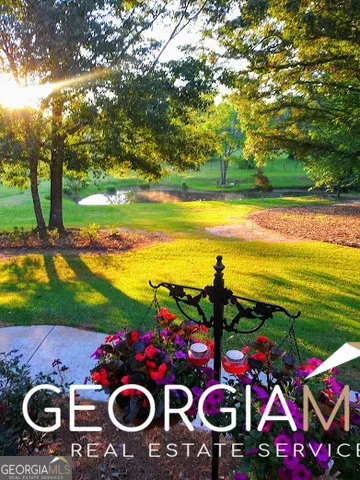 a view of a yard in front of the house with green space