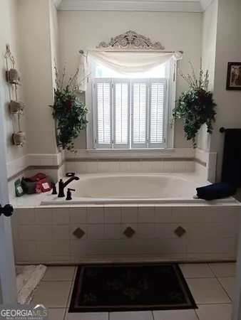 a view of a hallway with furniture