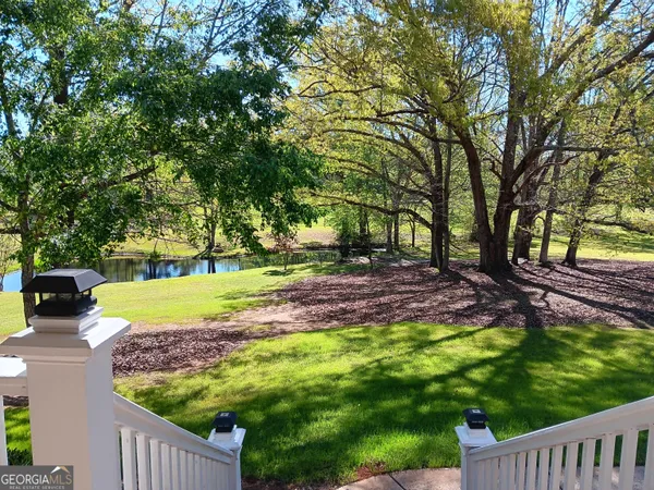 a living room with furniture window and wooden floor
