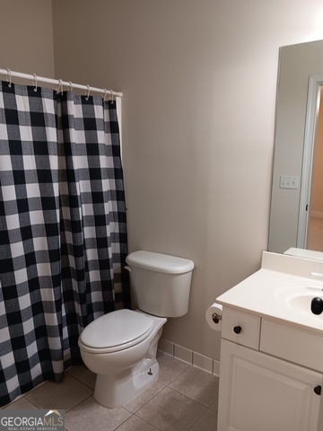 531 Grant Road Brooks, GA 30205 - Photo 55 of 92 a white toilet sitting next to a shower curtain