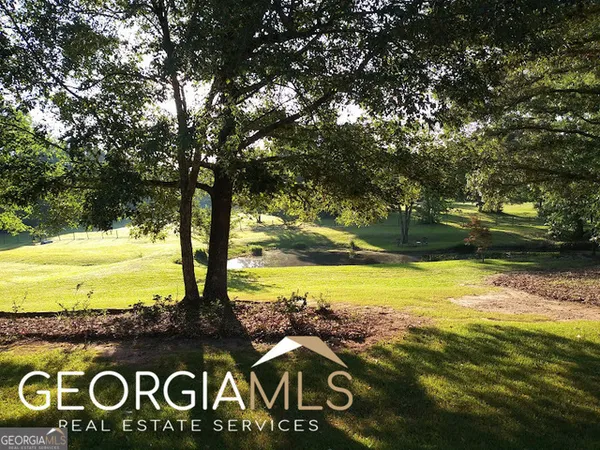 a kitchen with a counter space a sink and a large window