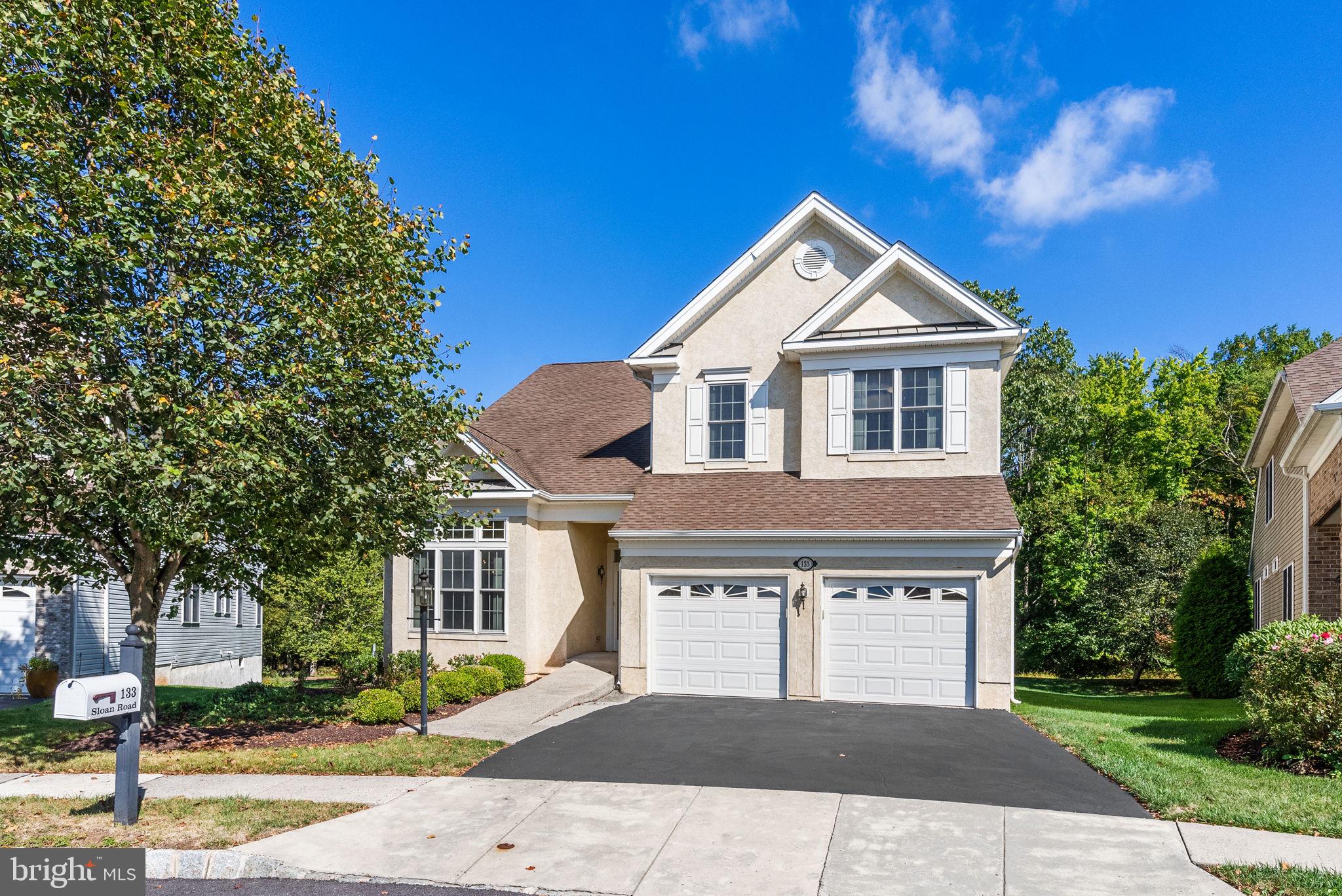 a front view of a house with yard
