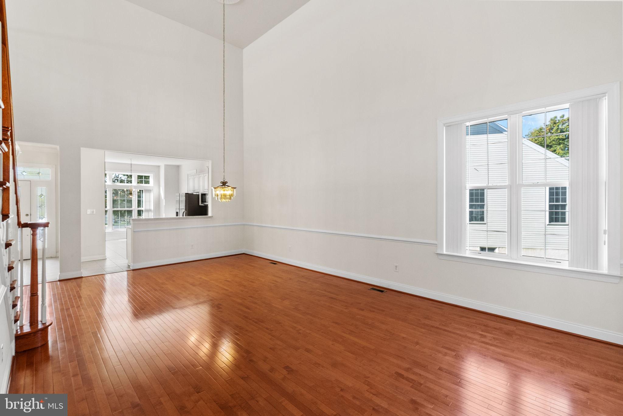 133 Sloan Road Phoenixville, PA 19460 - Photo 15 of 67 a view of an empty room with wooden floor and a window