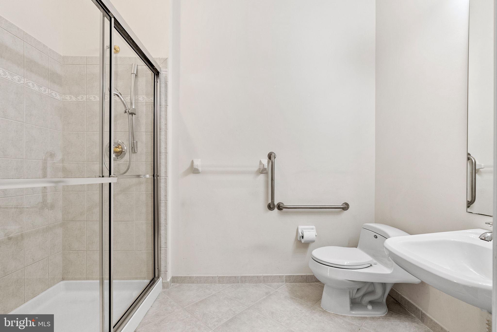 133 Sloan Road Phoenixville, PA 19460 - Photo 17 of 67 a bathroom with a toilet a sink and a shower