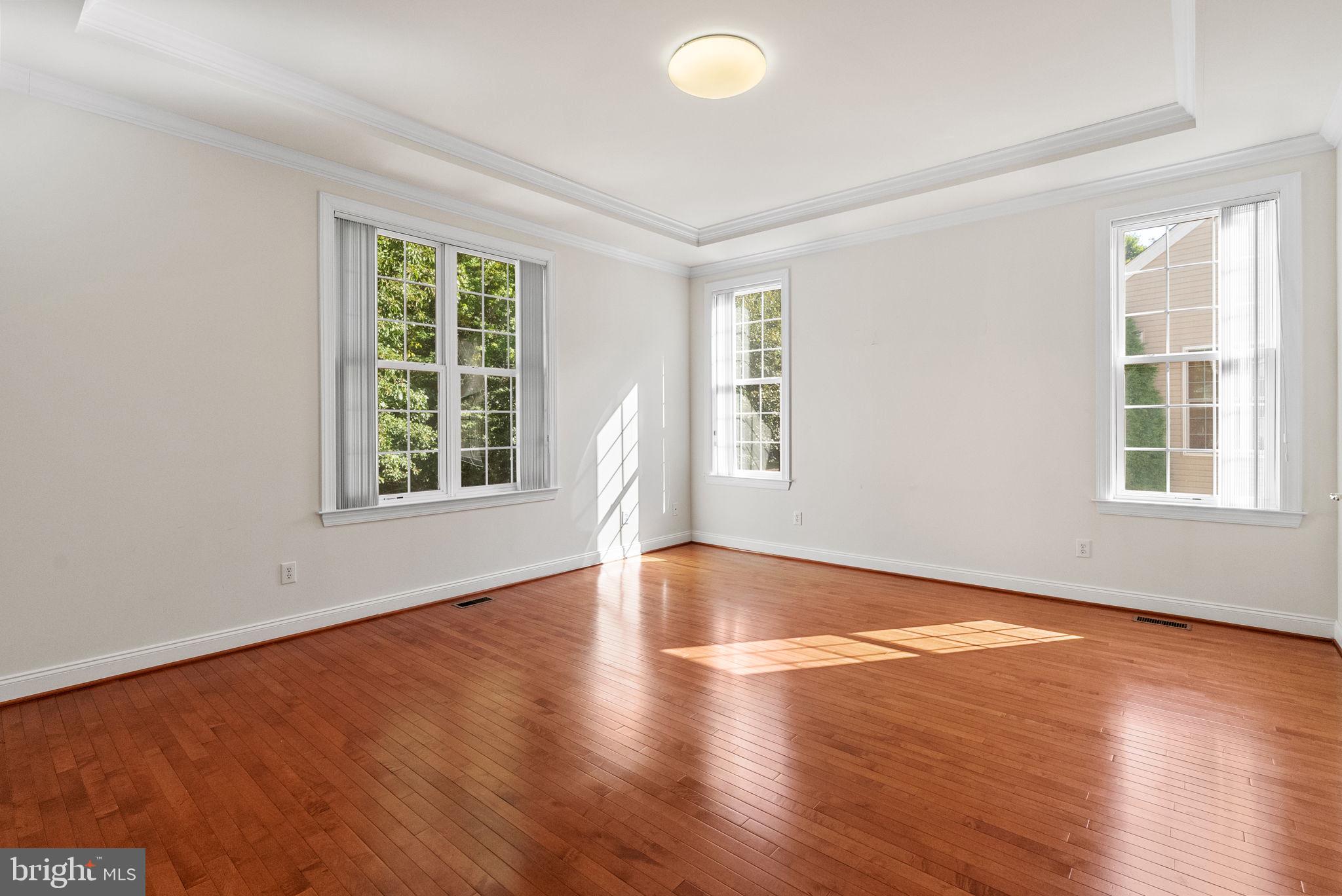 133 Sloan Road Phoenixville, PA 19460 - Photo 23 of 67 an empty room with wooden floor and windows