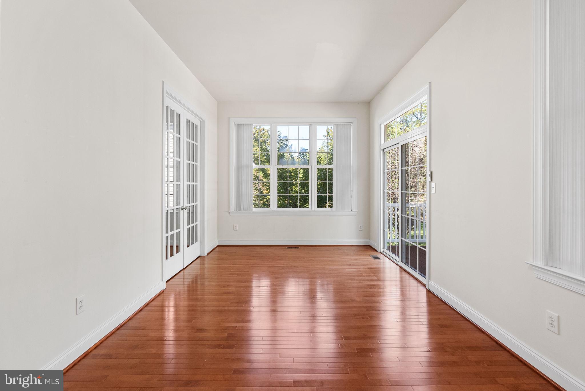 133 Sloan Road Phoenixville, PA 19460 - Photo 26 of 67 an empty room with wooden floor and windows
