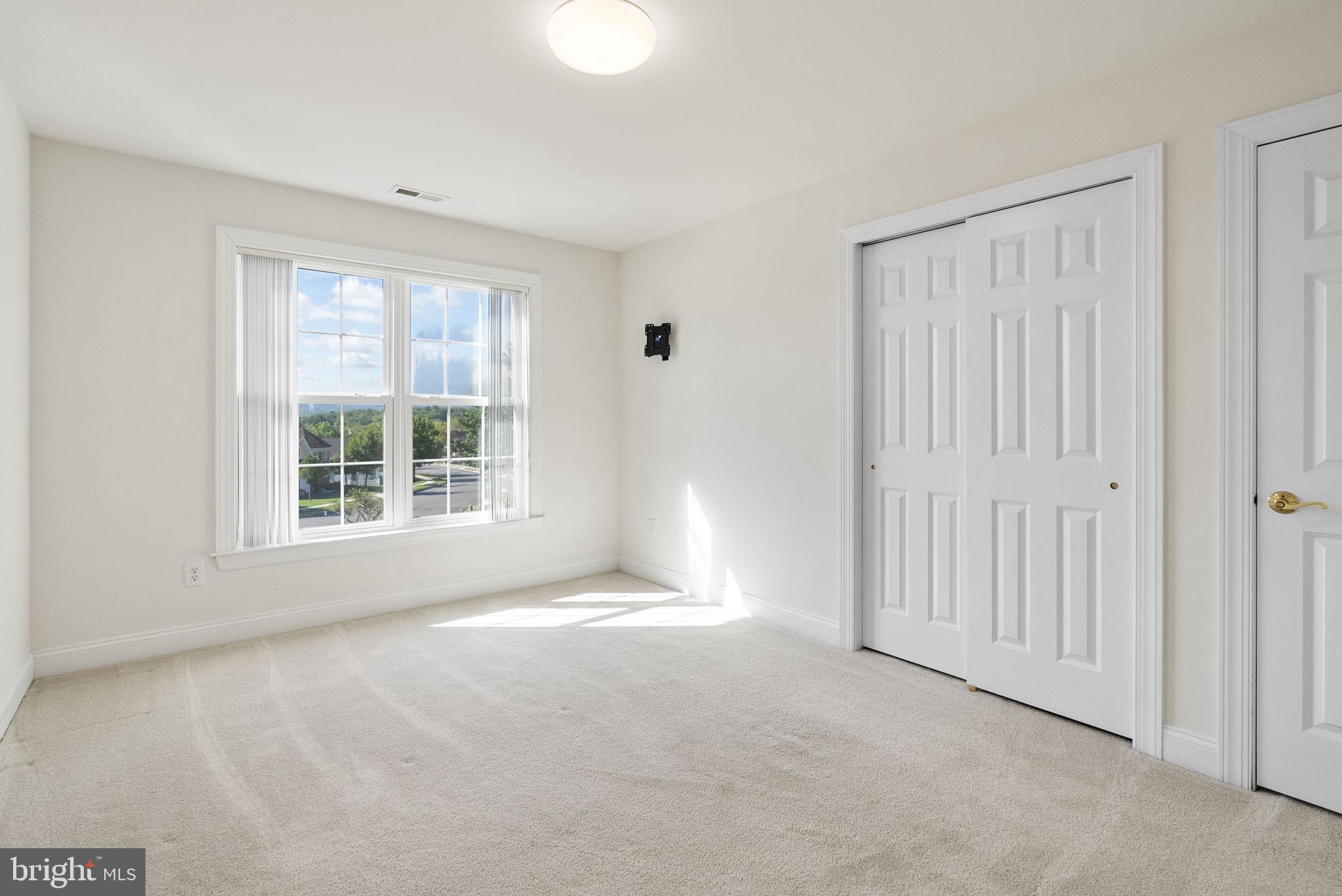 133 Sloan Road Phoenixville, PA 19460 - Photo 32 of 67 a view of an empty room with a window