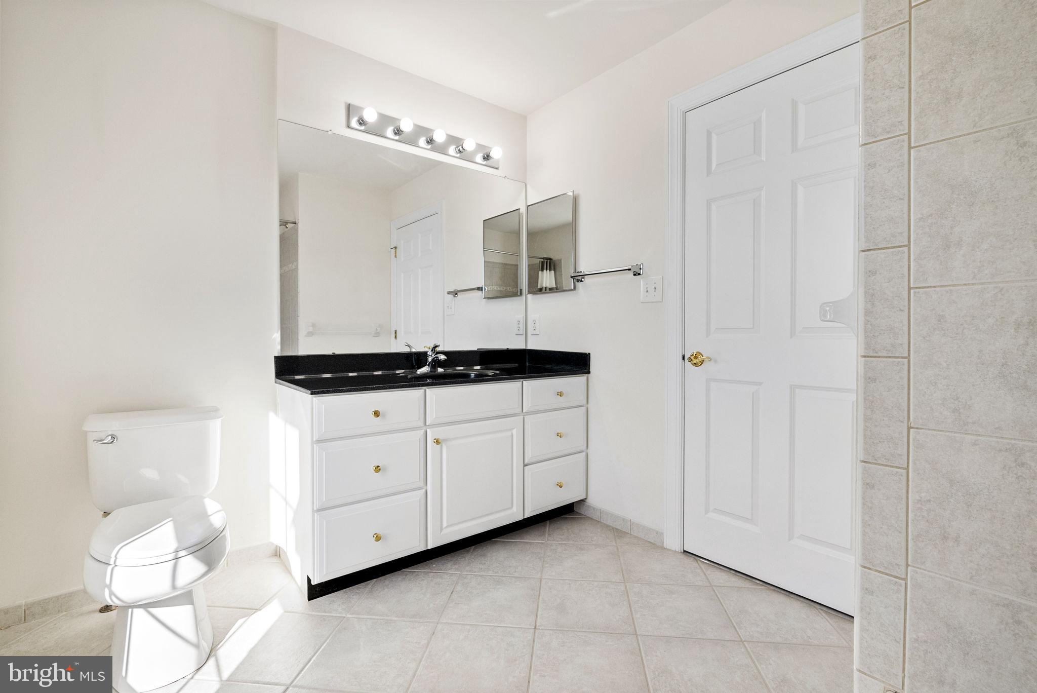 133 Sloan Road Phoenixville, PA 19460 - Photo 34 of 67 a spacious bathroom with a double vanity sink and mirror