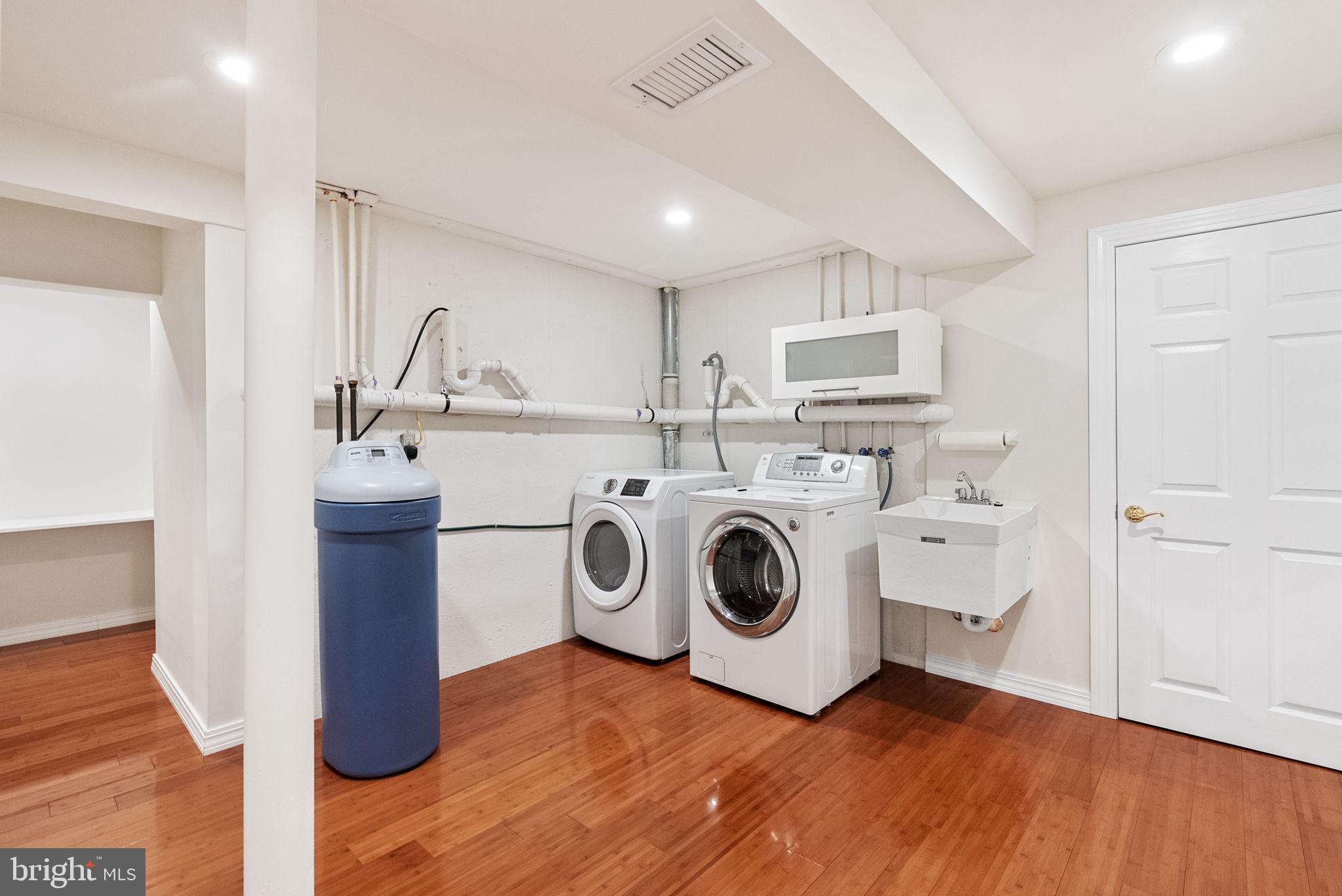 133 Sloan Road Phoenixville, PA 19460 - Photo 35 of 67 a utility room with dryer washer and empty racks