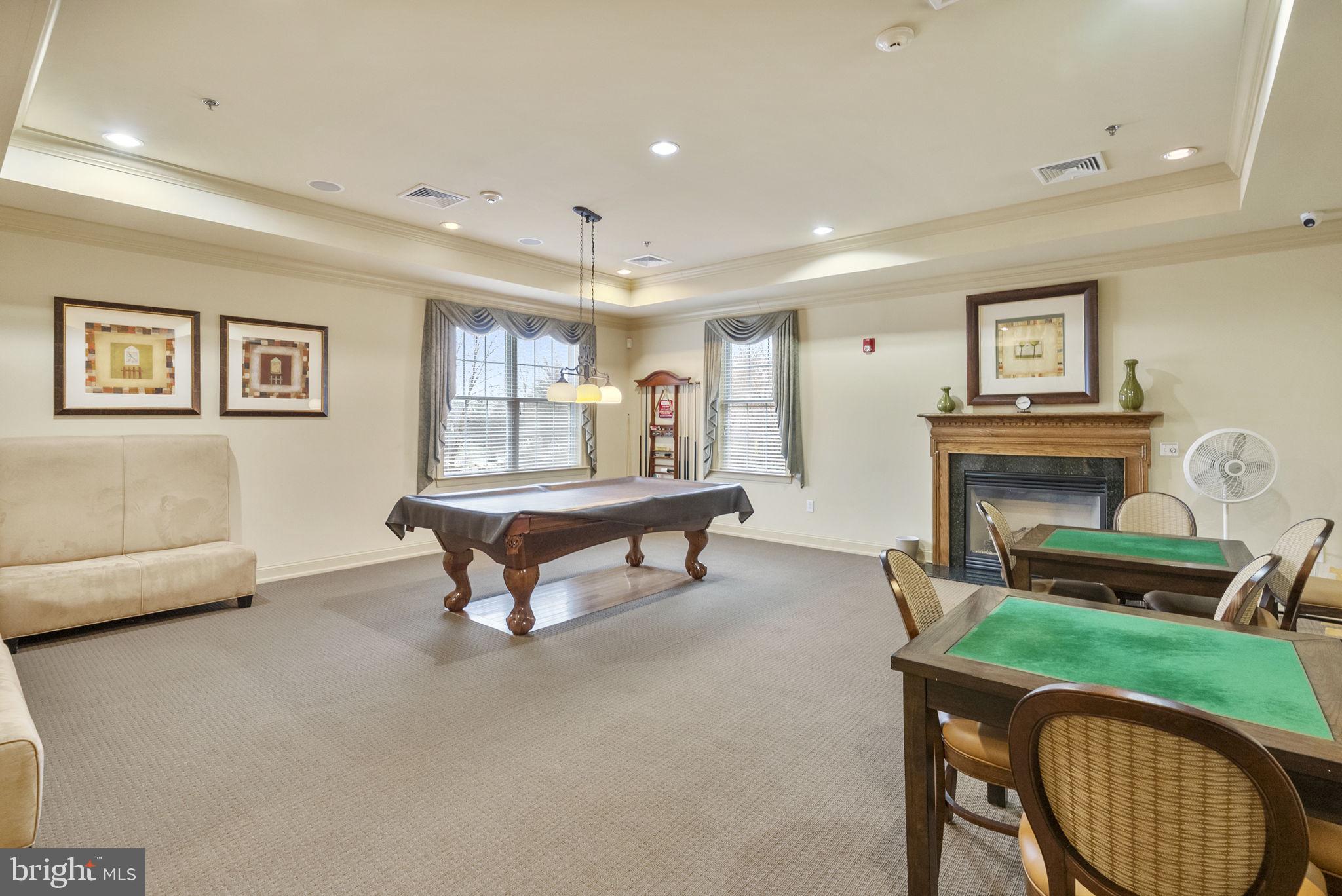 133 Sloan Road Phoenixville, PA 19460 - Photo 60 of 67 a living room with furniture a table and a fireplace