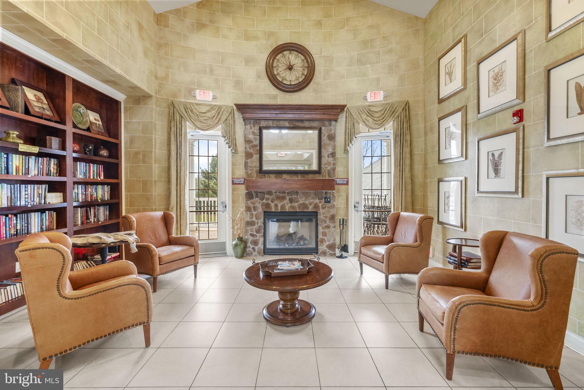 133 Sloan Road Phoenixville, PA 19460 - Photo 62 of 67 a living room with furniture a rug and a fireplace