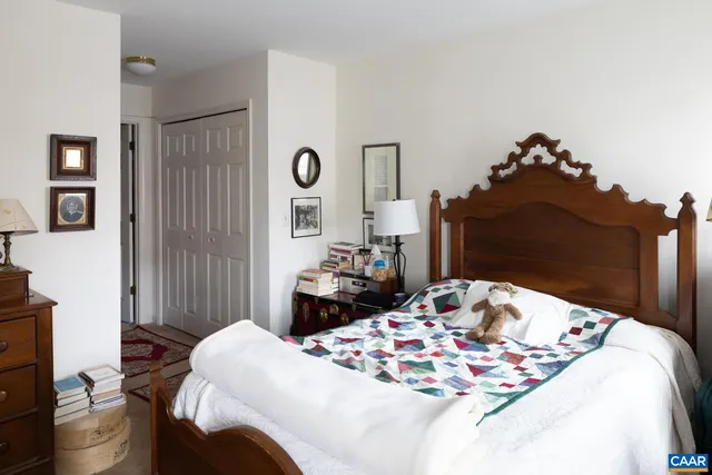 a bedroom with a bed and a dresser