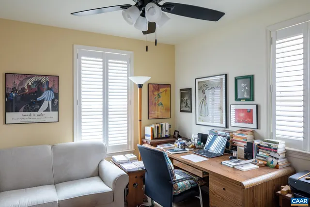 a view of a livingroom with furniture and a window