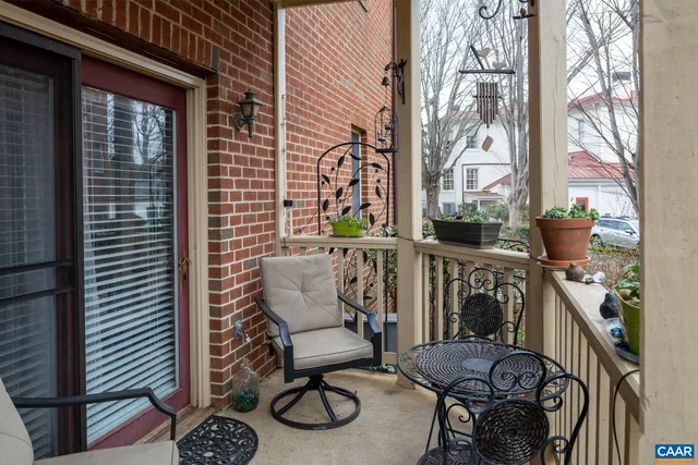 a view of a balcony with chairs