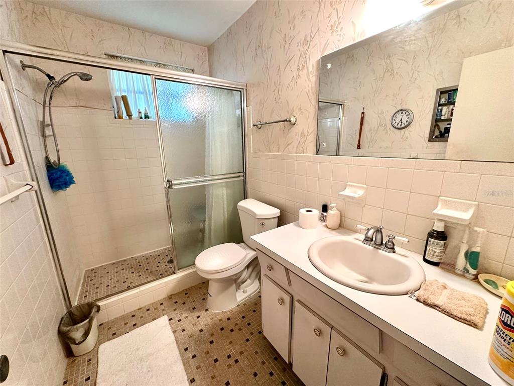 2404 Florentine Way, Unit 2 Clearwater, FL 33763 - Photo 12 of 37 a bathroom with a sink toilet and shower