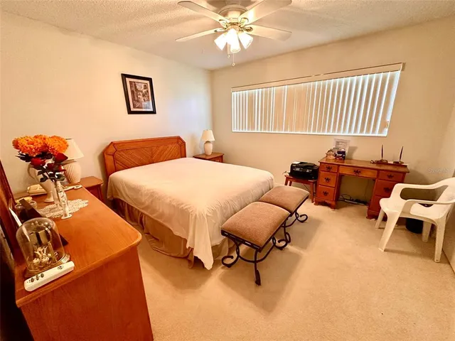 a bedroom with two beds and a chandelier