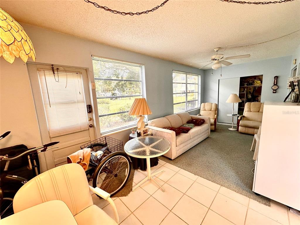 2404 Florentine Way, Unit 2 Clearwater, FL 33763 - Photo 17 of 37 a living room with furniture and a large window