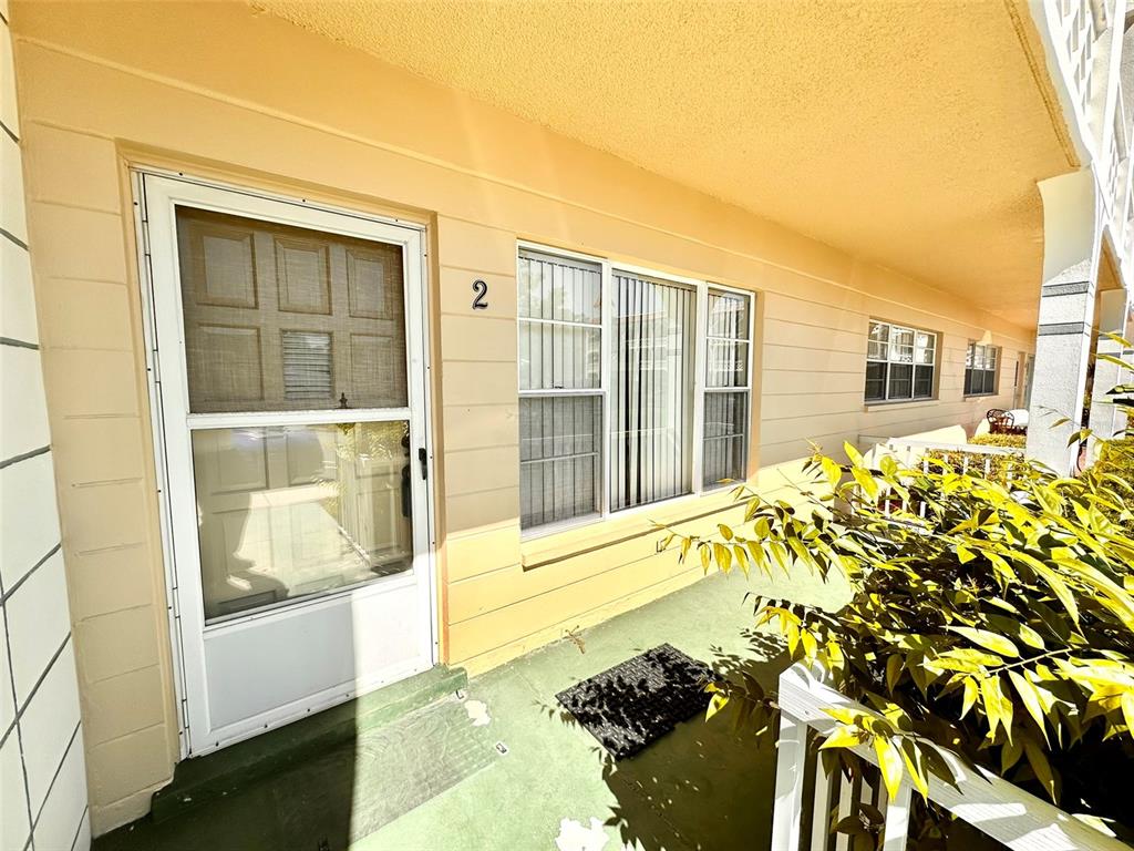 2404 Florentine Way, Unit 2 Clearwater, FL 33763 - Photo 2 of 37 a front view of a house with a outdoor space