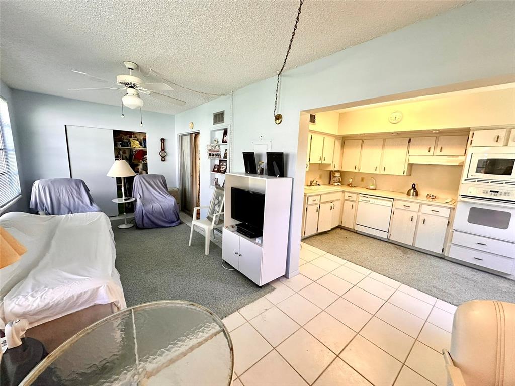 2404 Florentine Way, Unit 2 Clearwater, FL 33763 - Photo 7 of 37 a living room with furniture and a flat screen tv