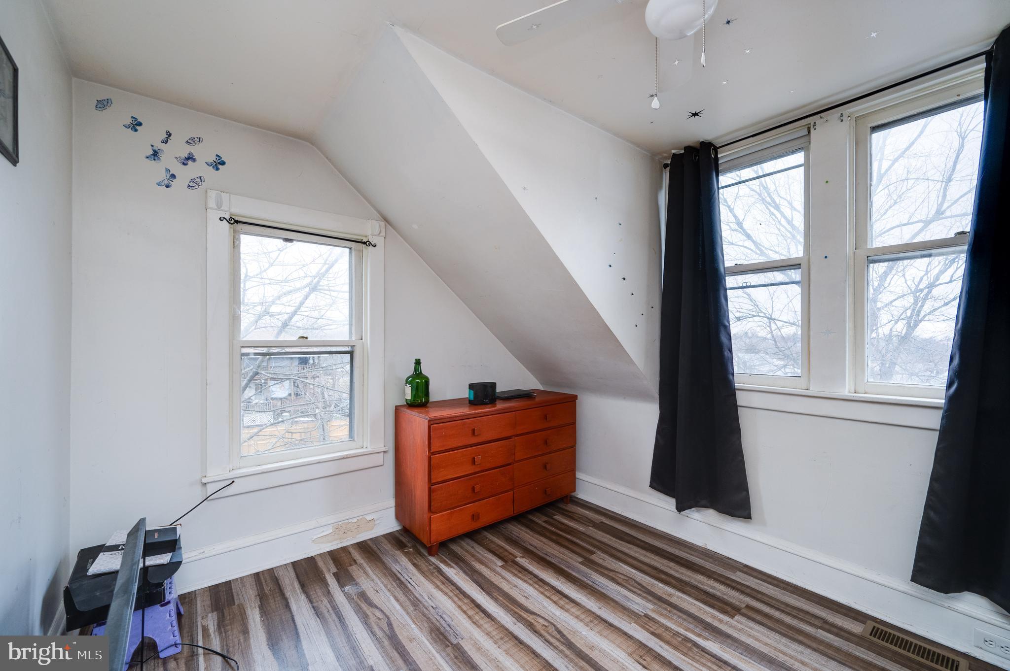 817 Philadelphia Avenue Reading, PA 19607 - Photo 11 of 20 a living room with hard wood floors and a window