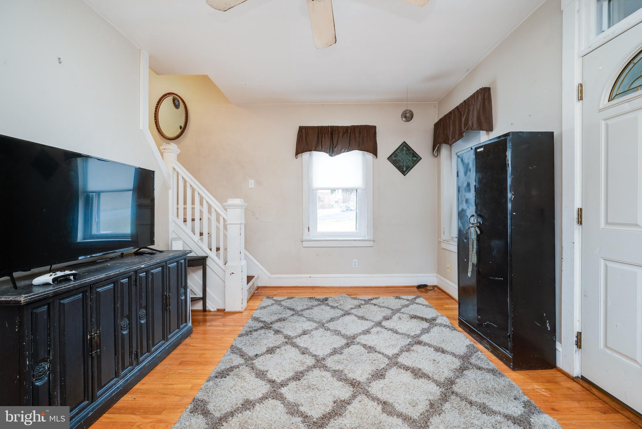 817 Philadelphia Avenue Reading, PA 19607 - Photo 3 of 20 a view of a hallway with windows and furniture