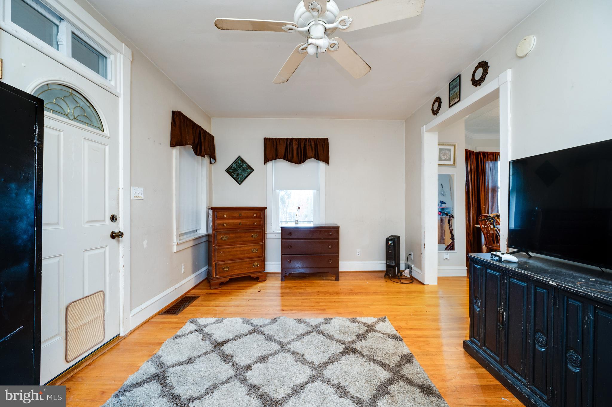 817 Philadelphia Avenue Reading, PA 19607 - Photo 4 of 20 a living room with furniture and a flat screen tv
