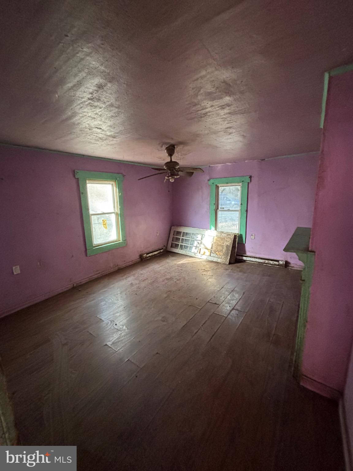 4695 Green Road Marion Station, MD 21838 - Photo 23 of 29 an empty room with windows and fireplace
