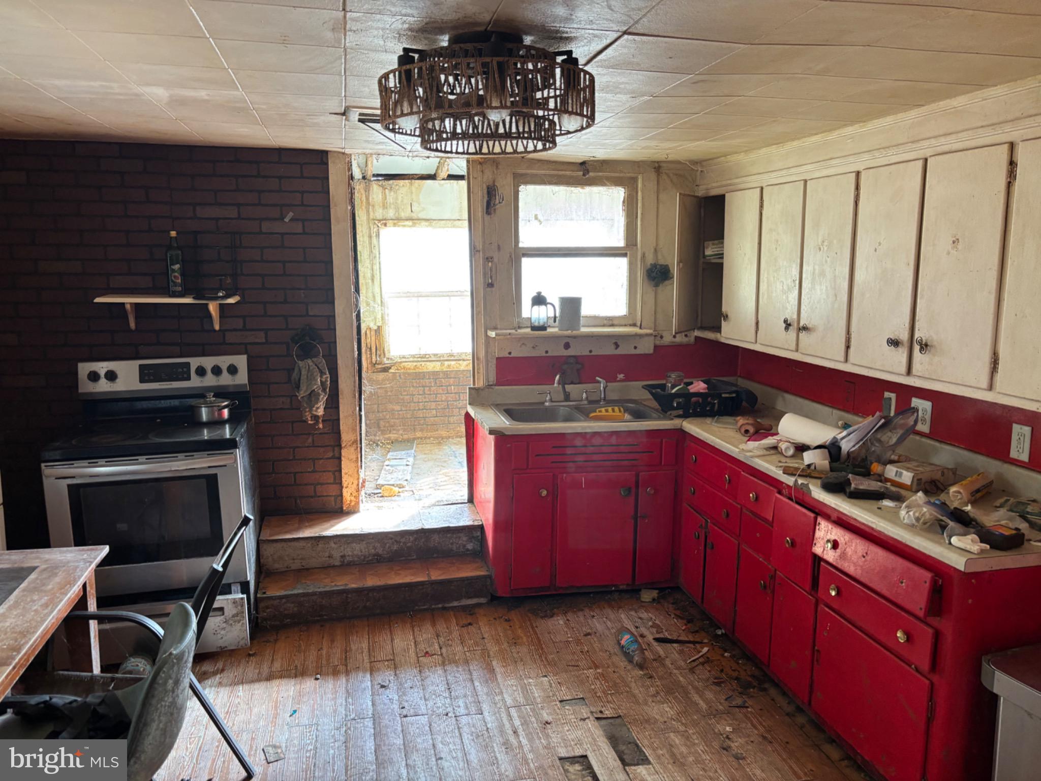 4695 Green Road Marion Station, MD 21838 - Photo 28 of 29 a kitchen with wooden floors and a stove
