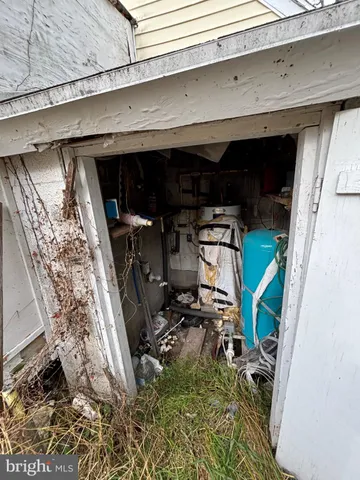 a front view of a house with yard and trees