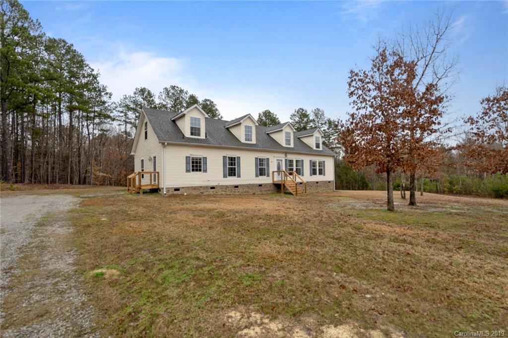 2804 Plyler Mill Road Lancaster, SC 29720 - Photo 2 of 32 a front view of a house with a yard
