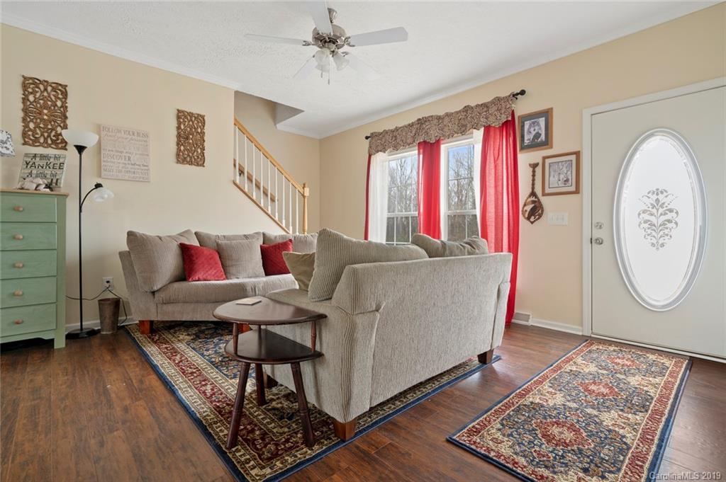 2804 Plyler Mill Road Lancaster, SC 29720 - Photo 17 of 32 a living room with furniture and a wooden floor