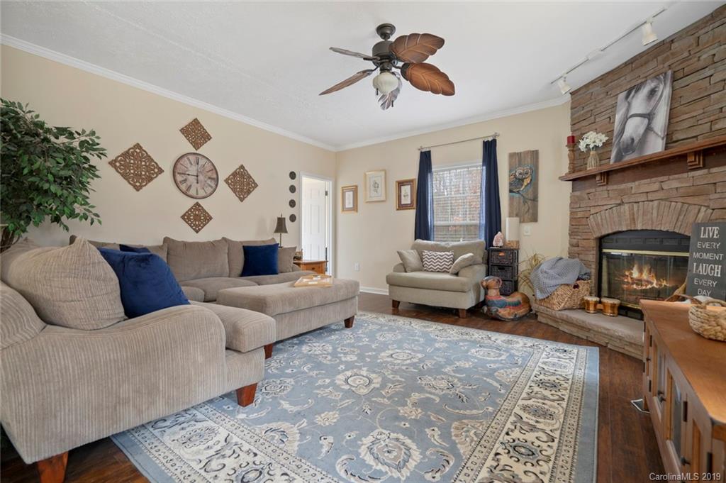 2804 Plyler Mill Road Lancaster, SC 29720 - Photo 3 of 32 a living room with furniture and a fireplace