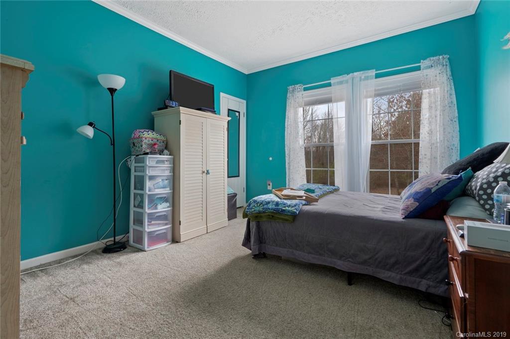 2804 Plyler Mill Road Lancaster, SC 29720 - Photo 24 of 32 a bed room with a bed and a window