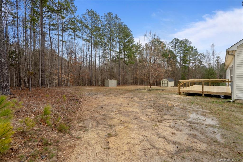 2804 Plyler Mill Road Lancaster, SC 29720 - Photo 31 of 32 a backyard of a house with lots of green space