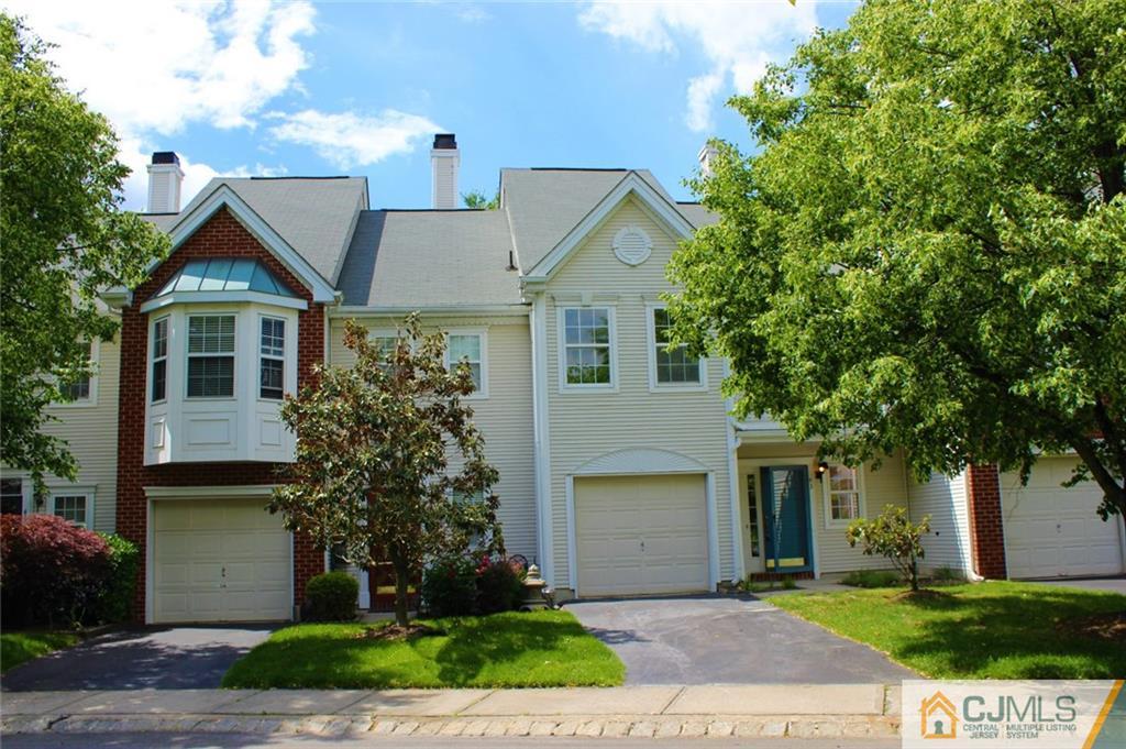 43 Alpine Road Holmdel, NJ 07733 - Photo 1 of 25 a front view of a house with a garden and trees