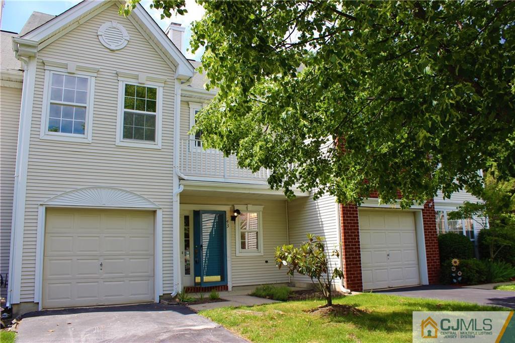 43 Alpine Road Holmdel, NJ 07733 - Photo 2 of 25 a front view of a house with a yard garage and outdoor seating