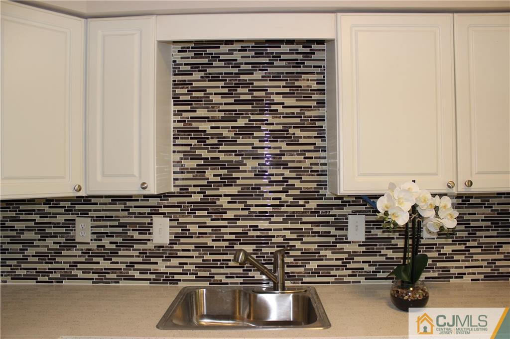 43 Alpine Road Holmdel, NJ 07733 - Photo 11 of 25 a bathroom with a sink and a mirror