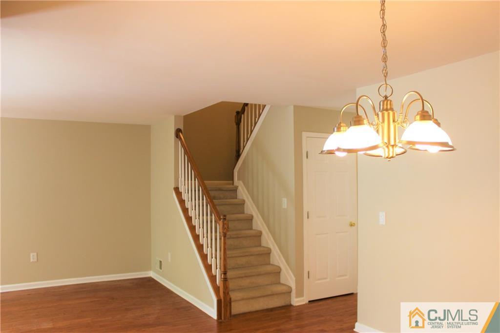 43 Alpine Road Holmdel, NJ 07733 - Photo 13 of 25 a view of entryway and hall with wooden floor