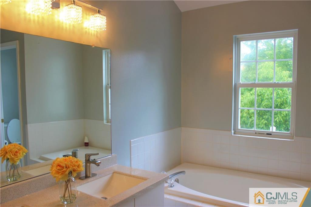 43 Alpine Road Holmdel, NJ 07733 - Photo 18 of 25 a bathroom with a tub and window