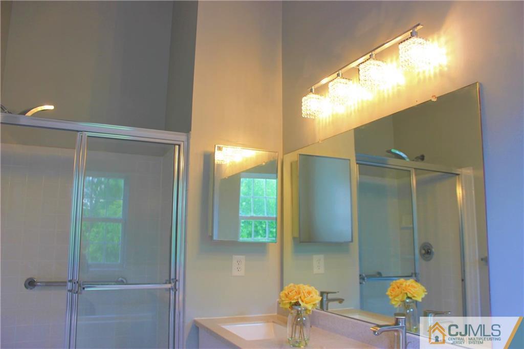 43 Alpine Road Holmdel, NJ 07733 - Photo 19 of 25 a bathroom with a sink and a mirror