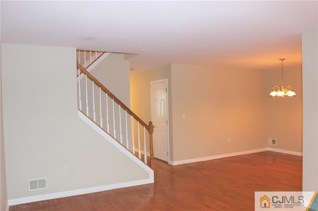 43 Alpine Road Holmdel, NJ 07733 - Photo 7 of 25 a view of a hallway with wooden floor