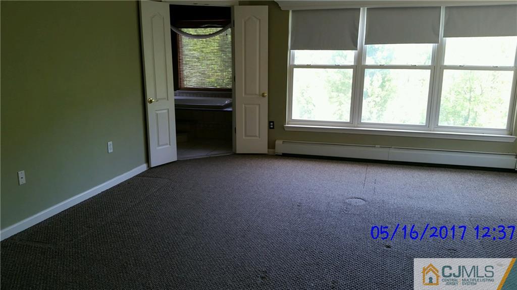 134 North Bergen Mills Road Monroe Township, NJ 08831 - Photo 6 of 11 a view of an empty room with a window