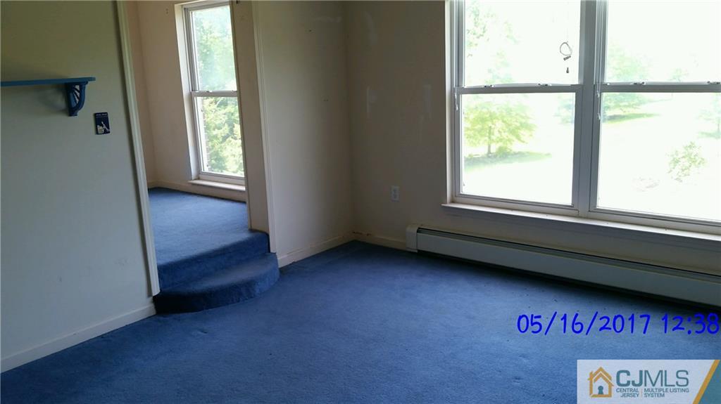 134 North Bergen Mills Road Monroe Township, NJ 08831 - Photo 8 of 11 a view of an empty room with a window