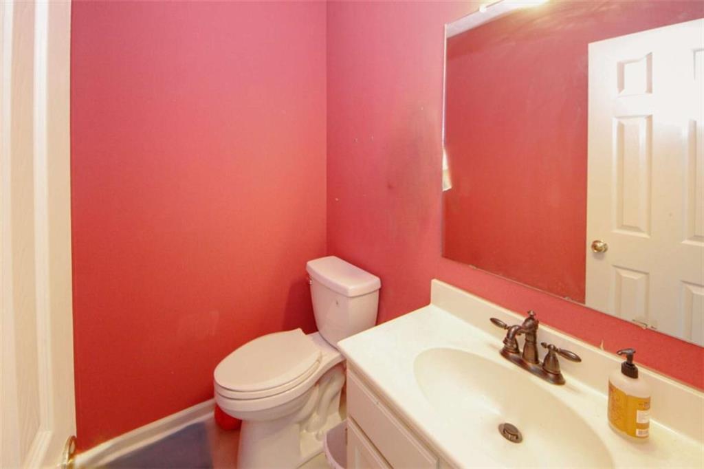 4025 Ivy Run Circle Duluth, GA 30096 - Photo 14 of 34 a bathroom with a sink a toilet and mirror